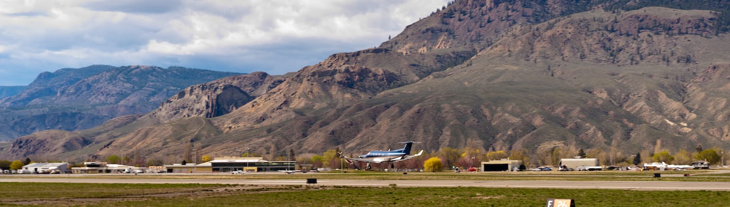 Airplane from a distance in a rural area